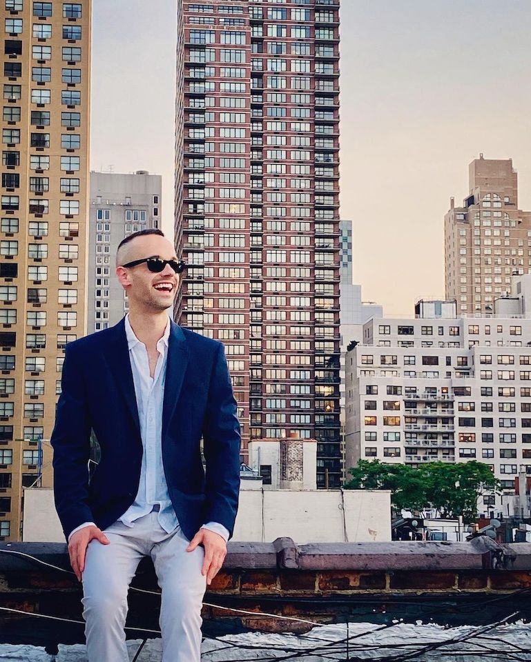Jazz piano NYC, Matt Dorland pianist NYC laughing on a Manhattan rooftop